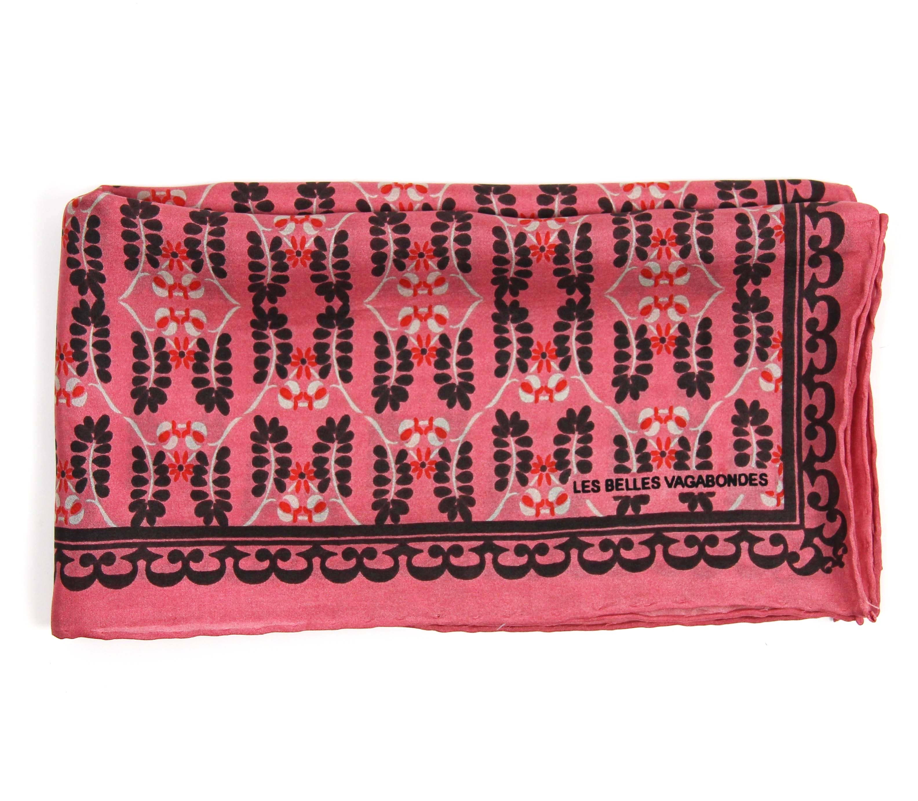 Pink fabric with black floral pattern and 'Les Belles Vagabondes' branding on a white background