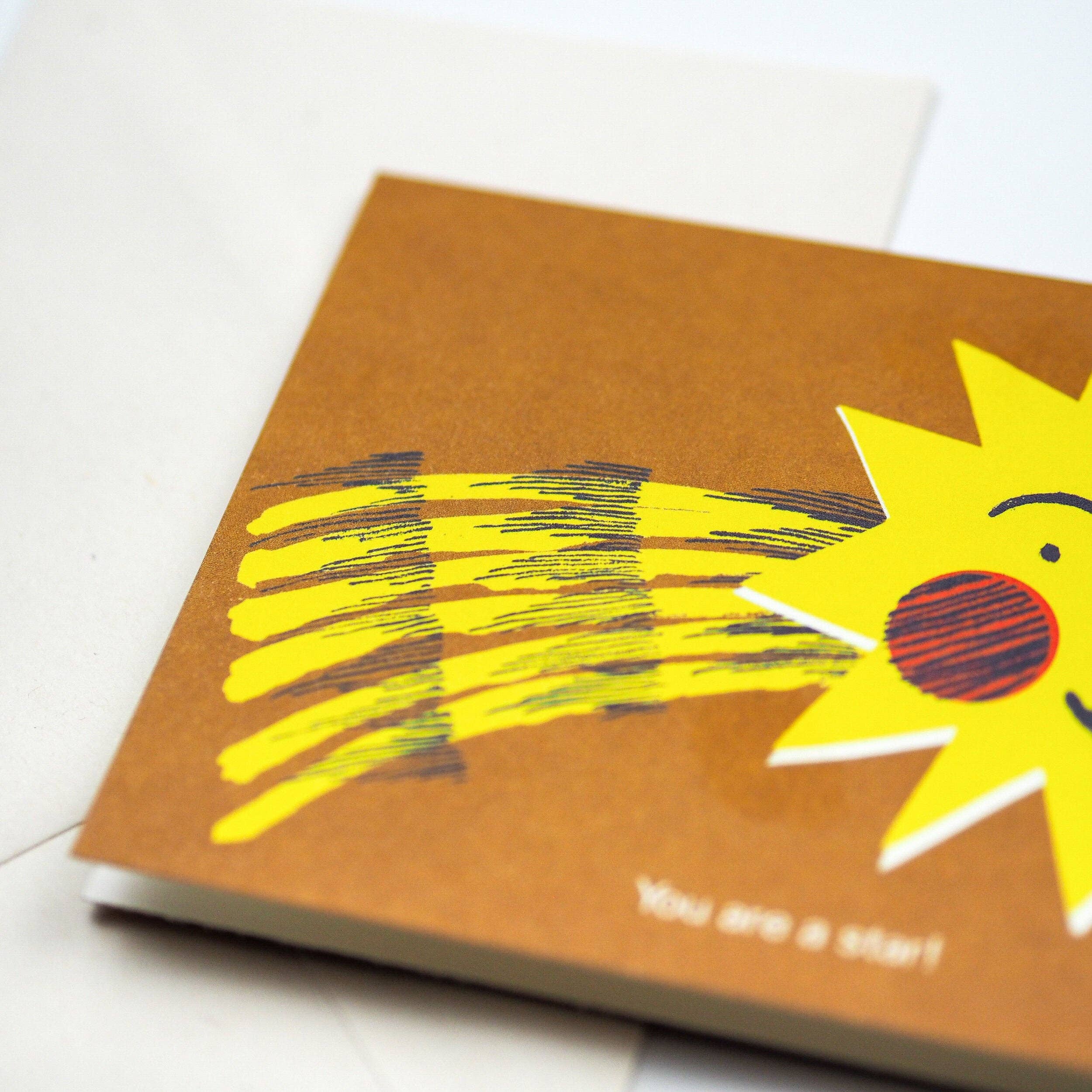 greetings card with a yellow sun illustration on a white background