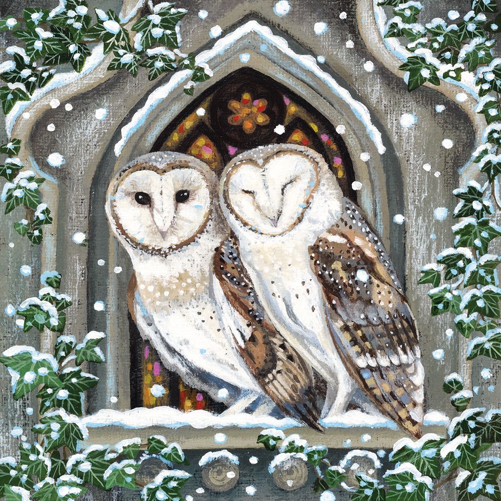 Two snowy owls in front of a stained glass window with ivy and snowflakes.