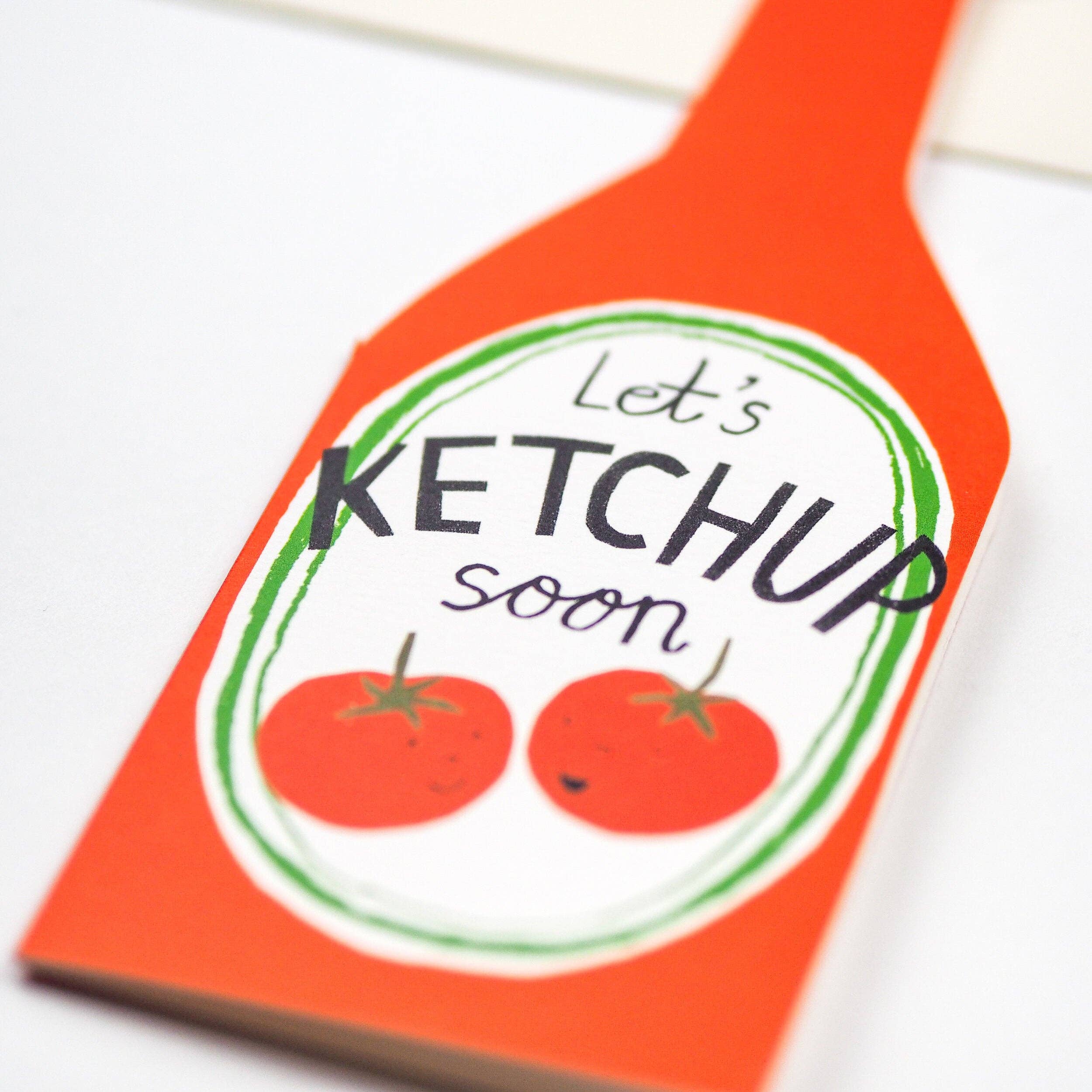 Ketchup bottle-shaped card with 'Let's Ketchup soon' text and tomato illustrations on a white background