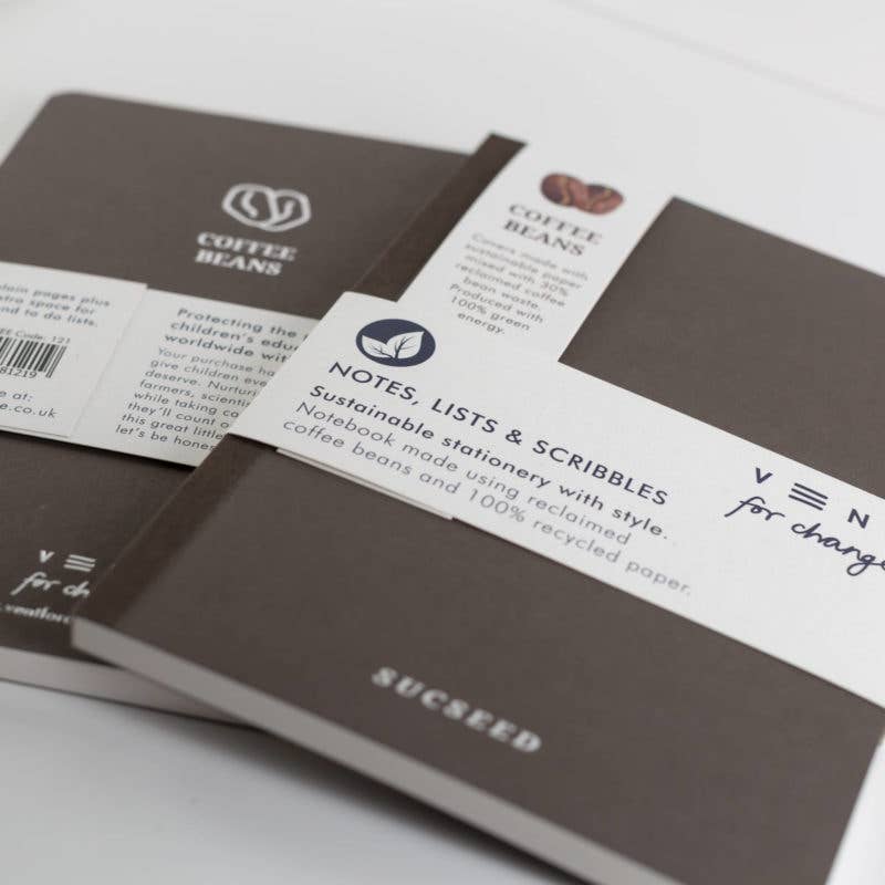 Sustainable stationery notebooks with visible branding on a white background