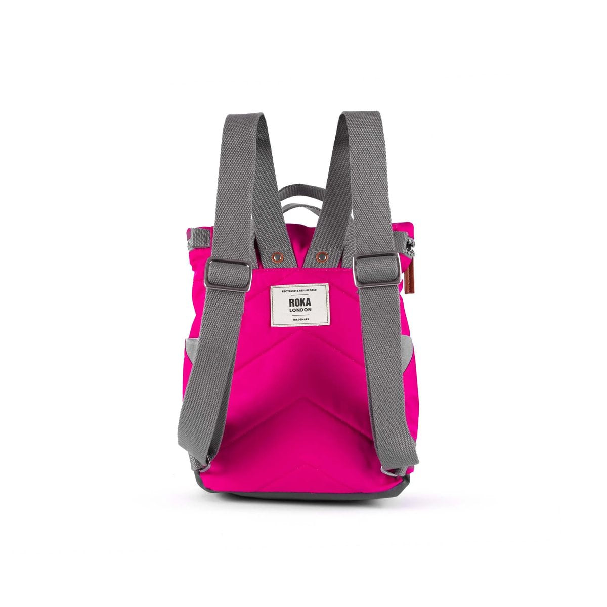 Back view of a pink backpack, showing a padded back and adjustable grey straps, shown on a white background