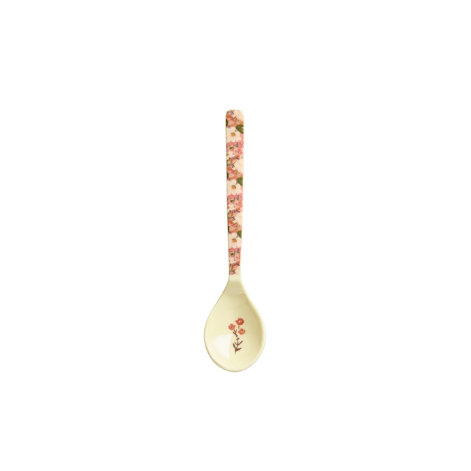 Decorative spoon with floral pattern on a white background