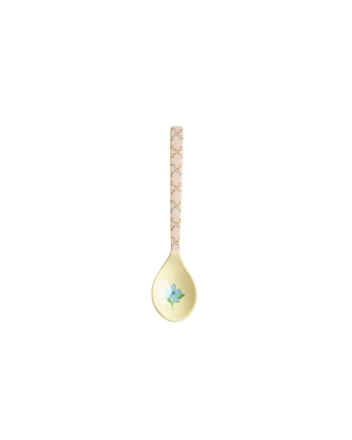 Decorative spoon with a floral design on a white background