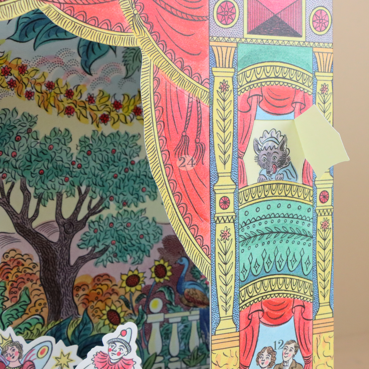 Colorful card with intricate patterns and characters, including a tree and people on a balcony.