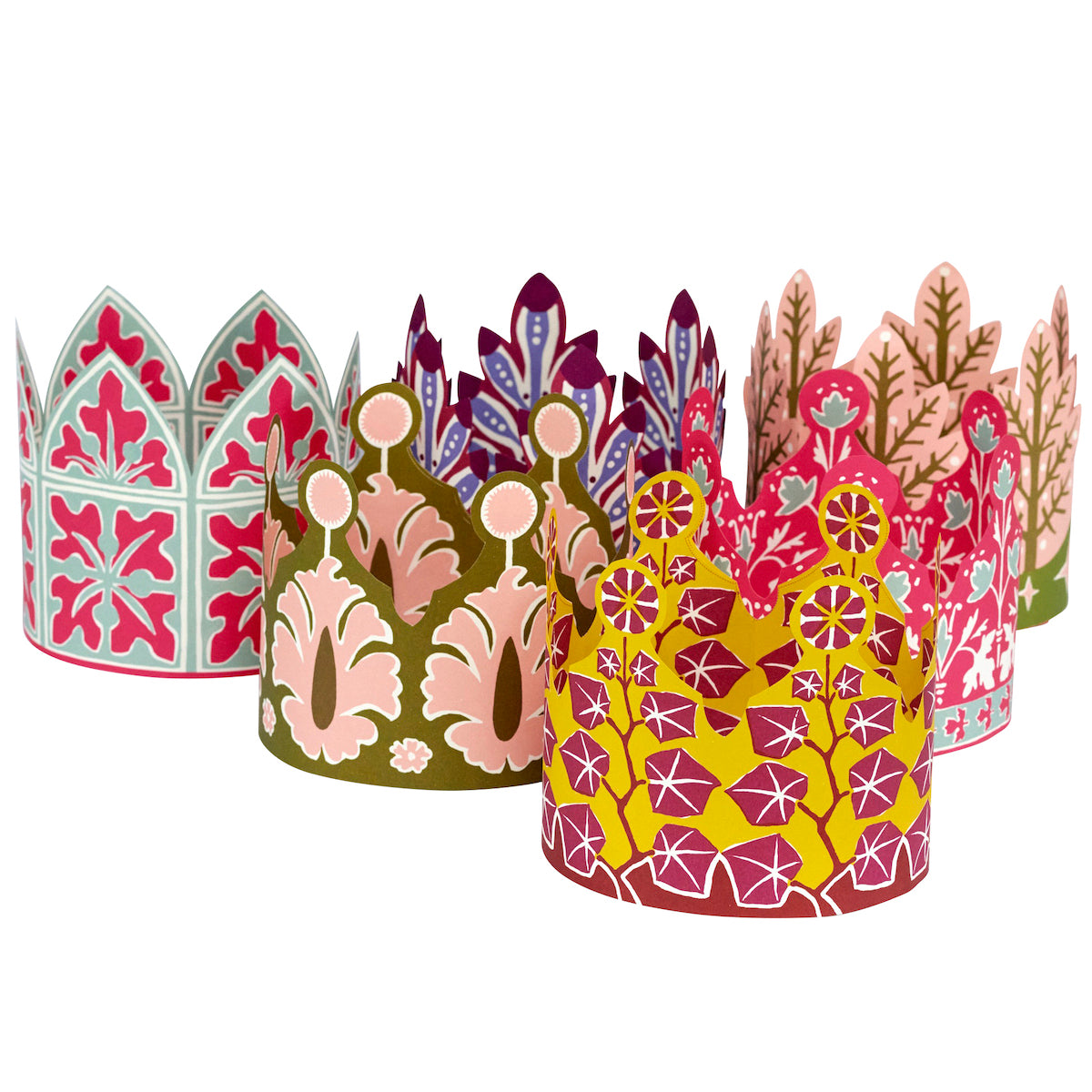Set of colorful paper crowns with floral patterns on a white background