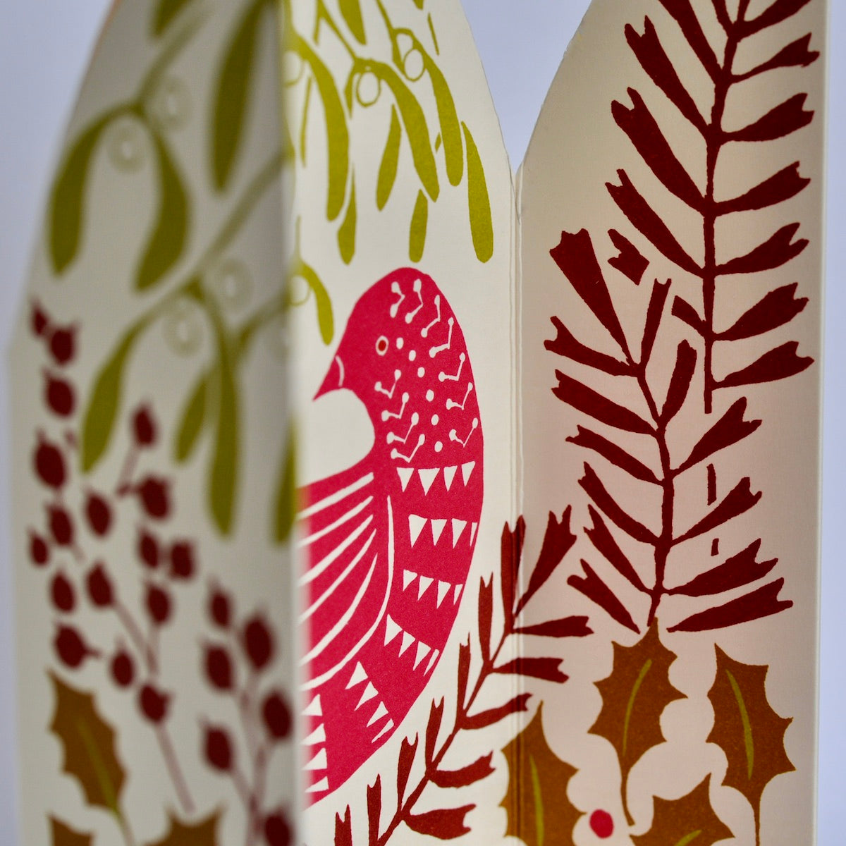 Decorative paper with bird and leaf patterns on a beige background
