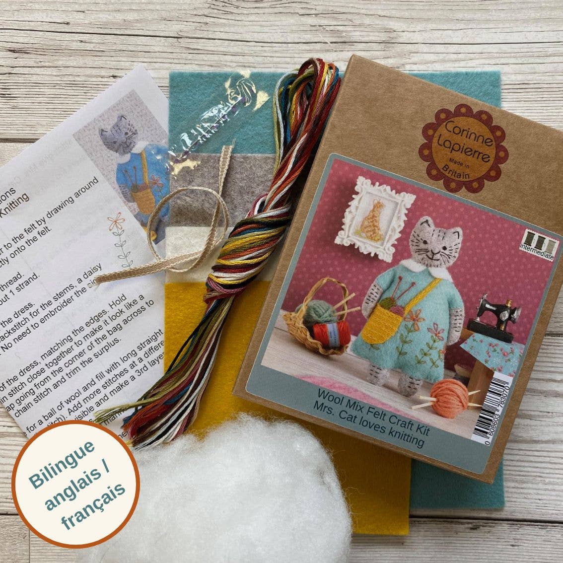Craft kit inclusions, showing a kraft packaging box, instructions sheet, threads, ribbon, needle, felt sheets and toy stuffing,