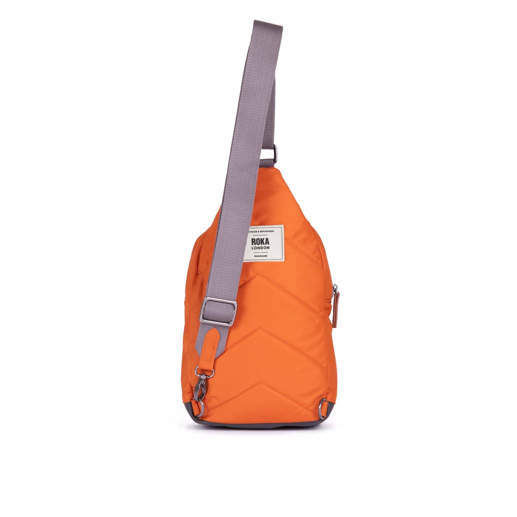 Orange sling bag with a gray strap on a white background