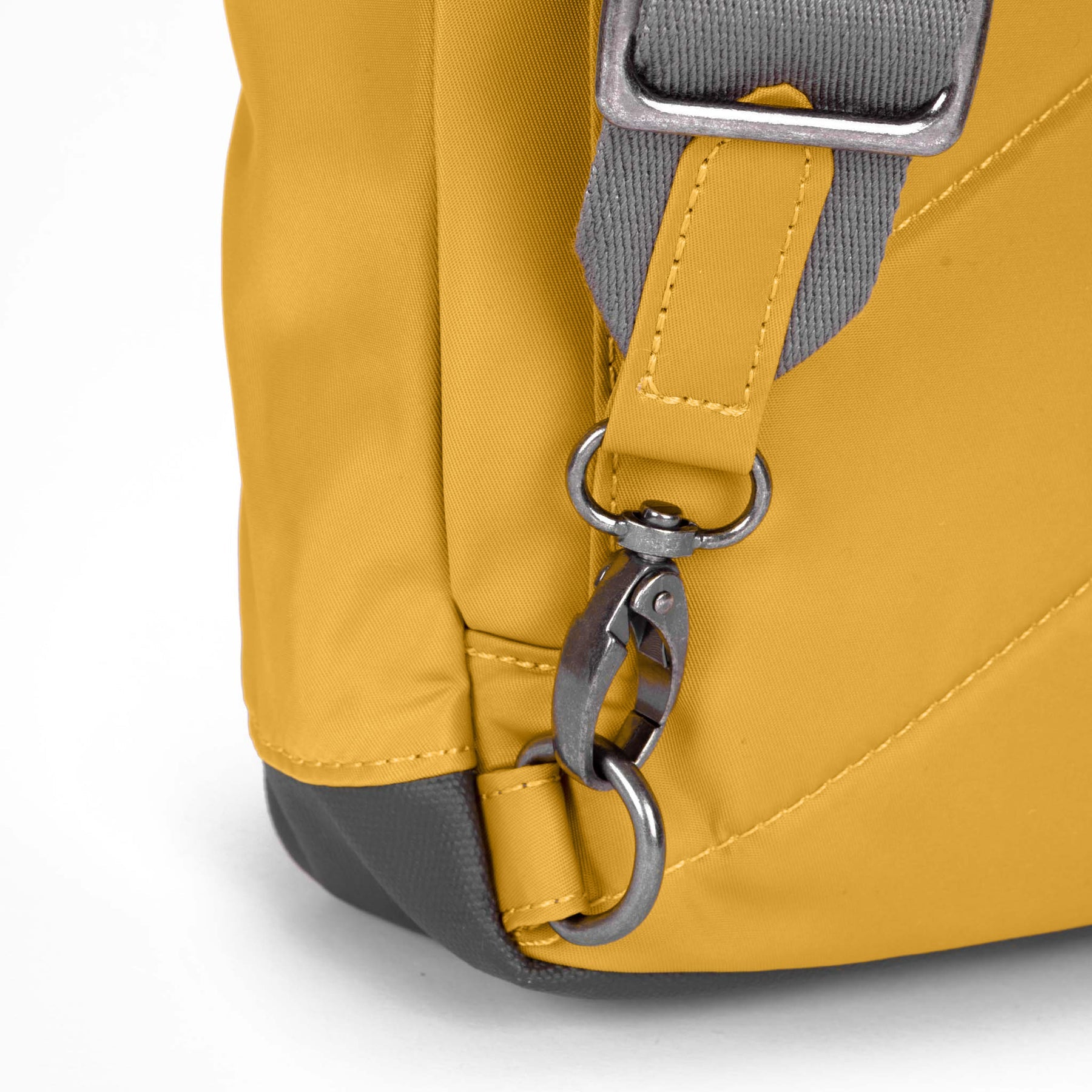 Yellow backpack with gray strap and metal clasp on a white background