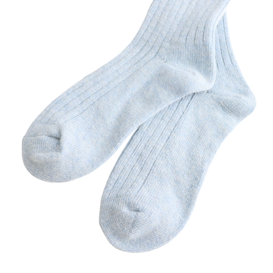 Pair of light gray socks on a white background