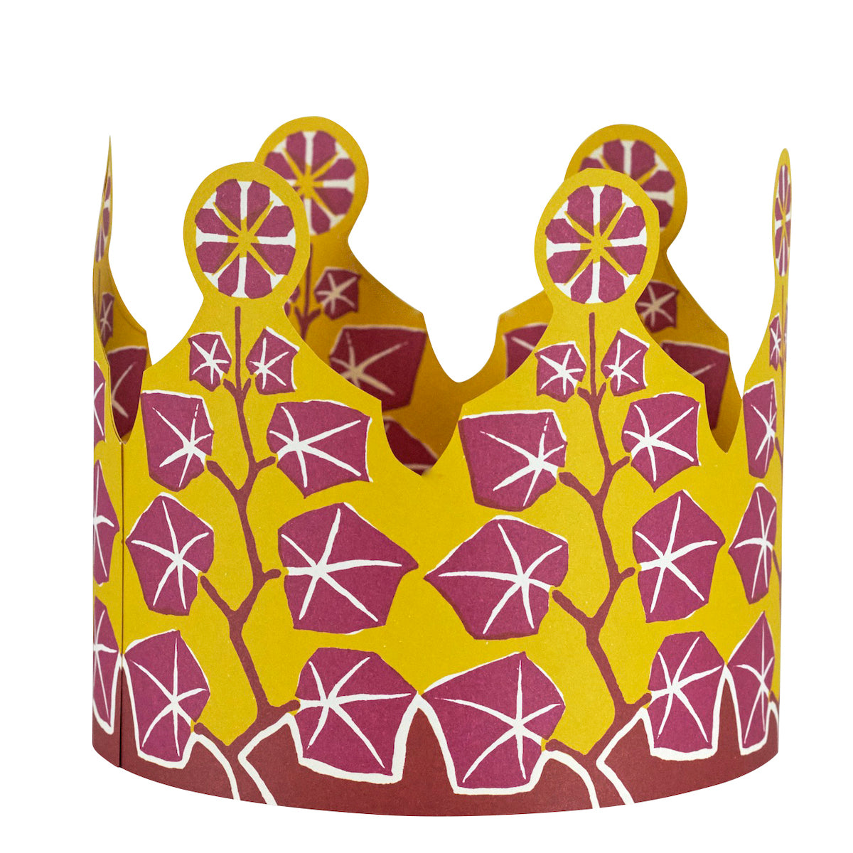 Decorative paper crown with purple floral pattern on a yellow background