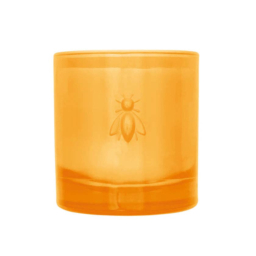 Orange candle with a bee logo on a white background