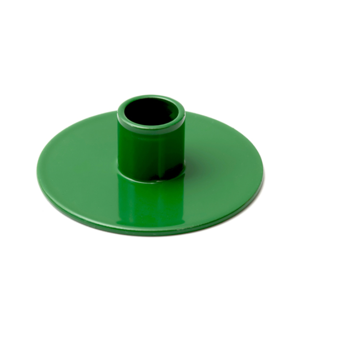 Green plastic component on a white background