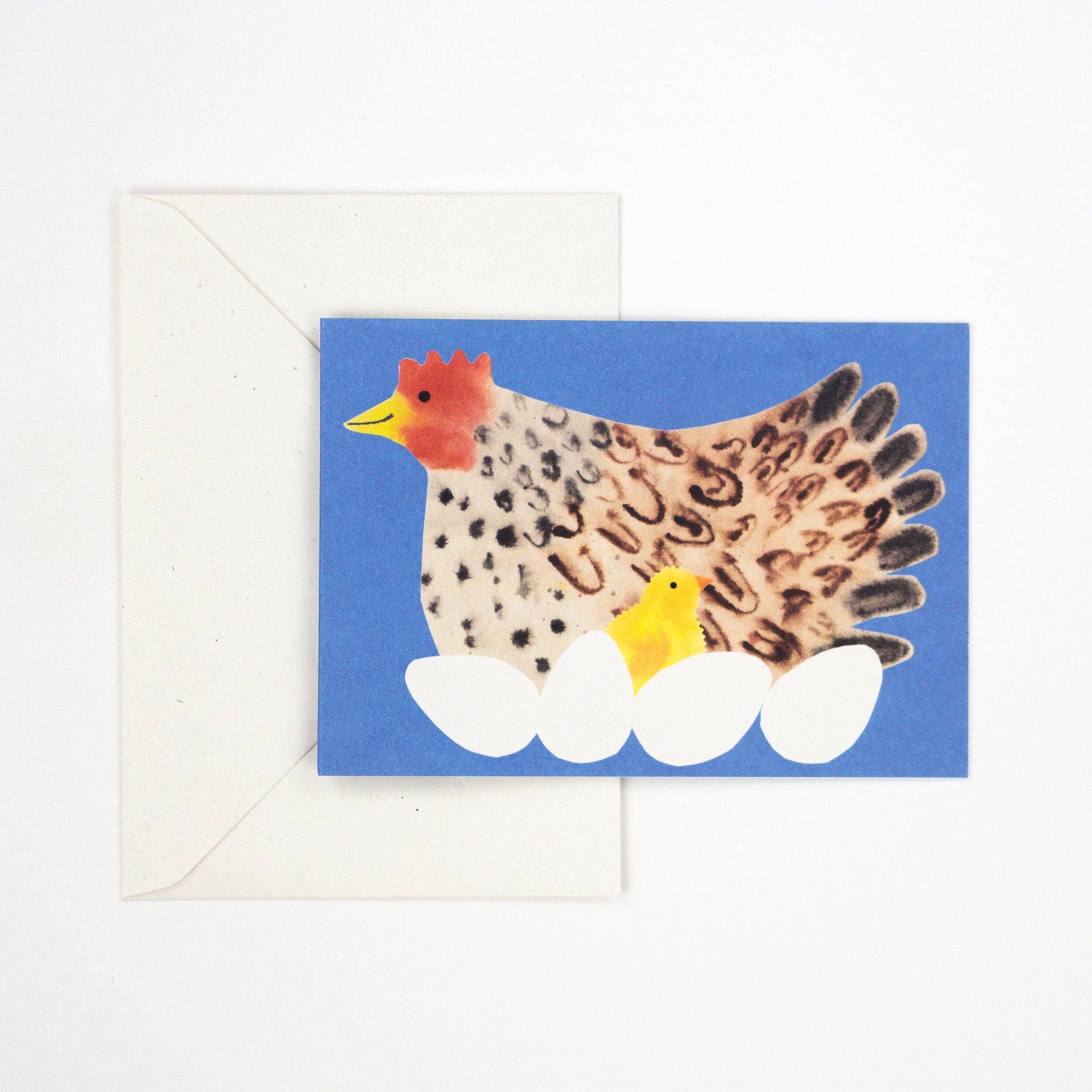 Card with a chicken and chick design on a blue background