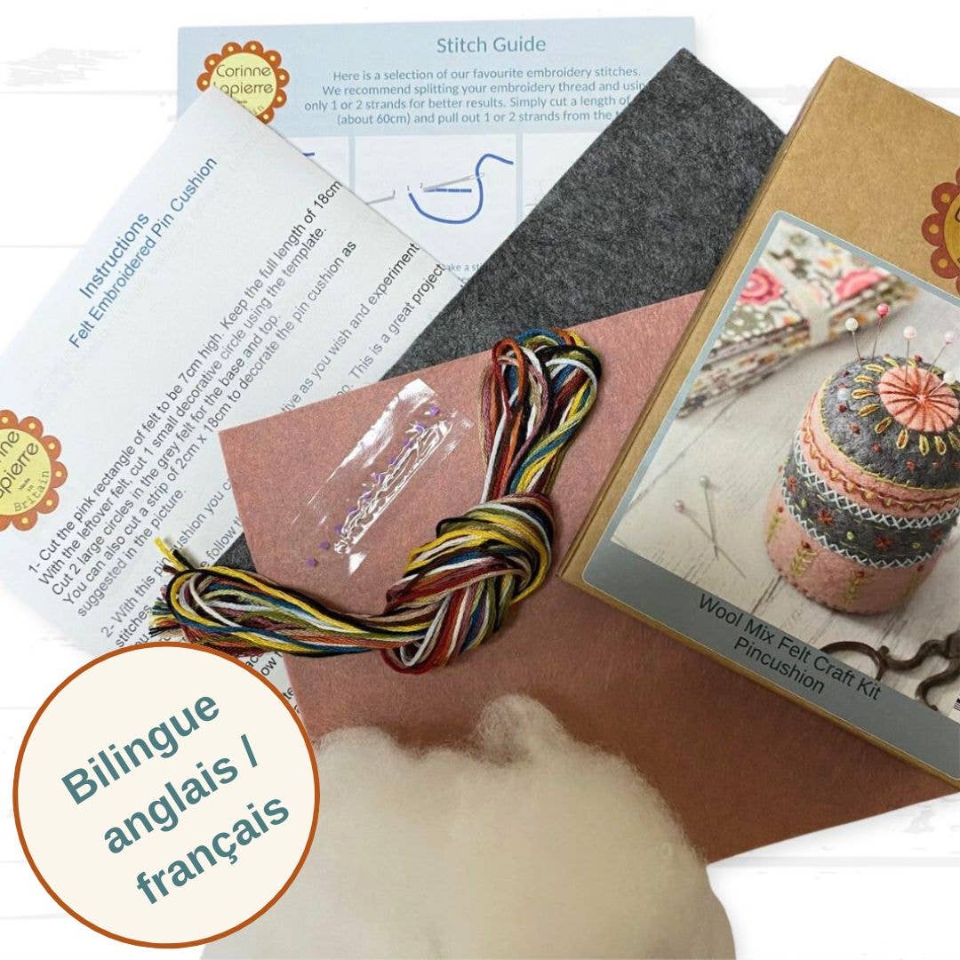 Embroidery kit with felt pieces, thread, and instructions on a white background