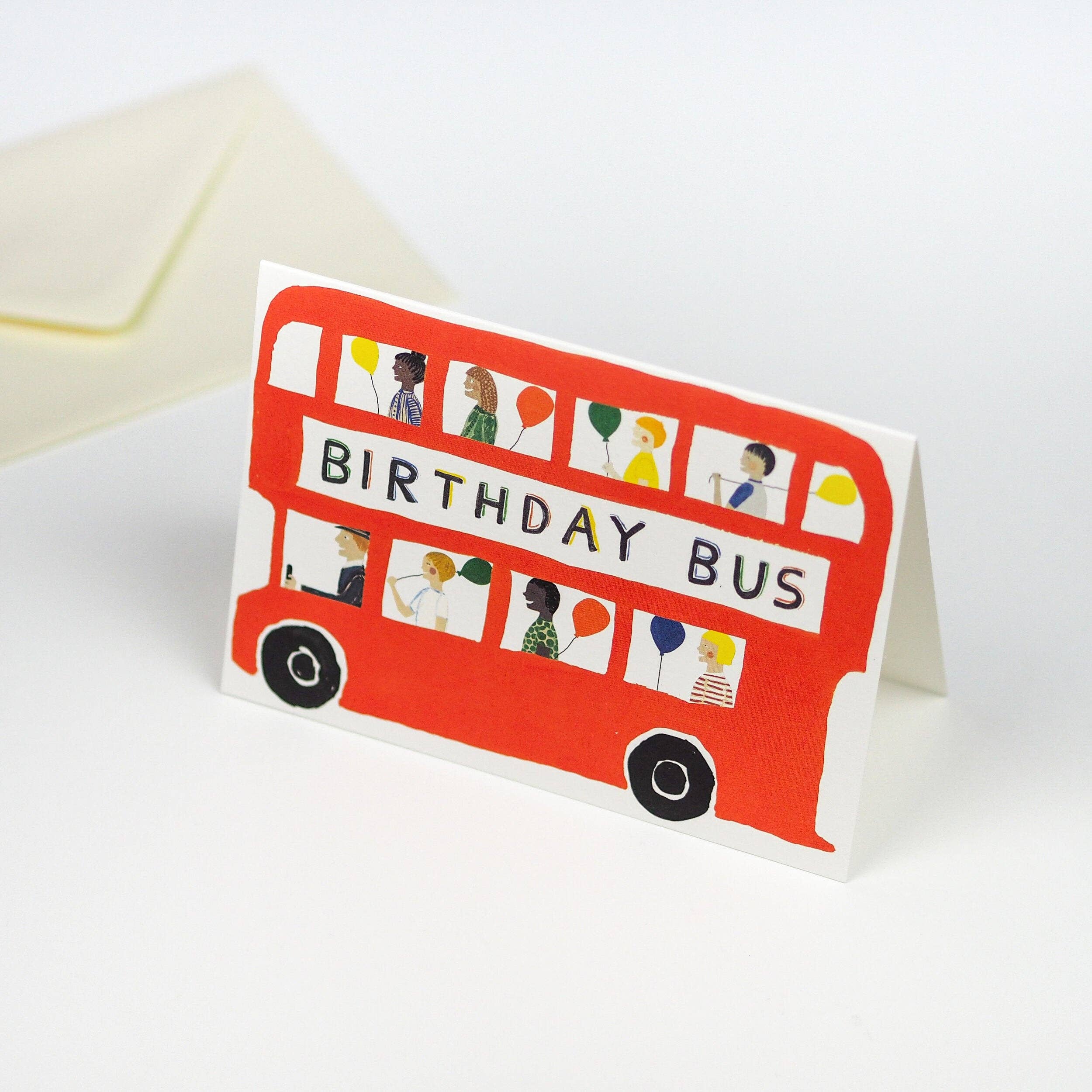 Birthday card with a red bus design on a white background