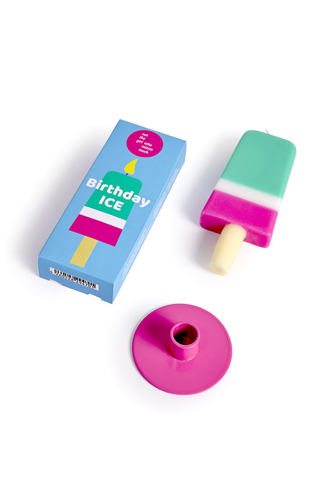 Birthday-themed ice pop with packaging and a small pink candle on a white background
