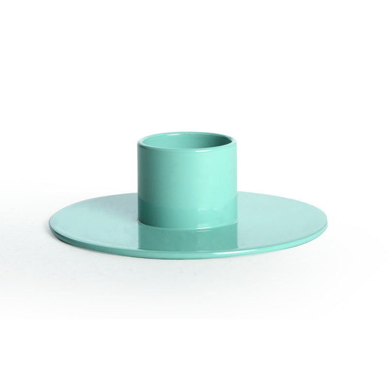 Turquoise glass candle holder on a white background