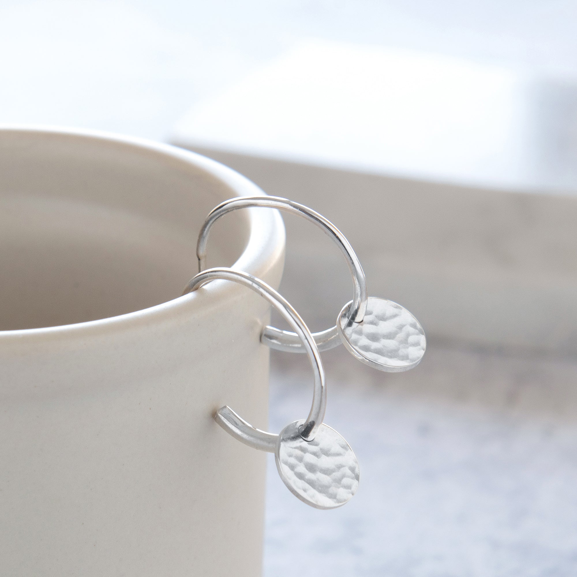 half hoop earring on cup
