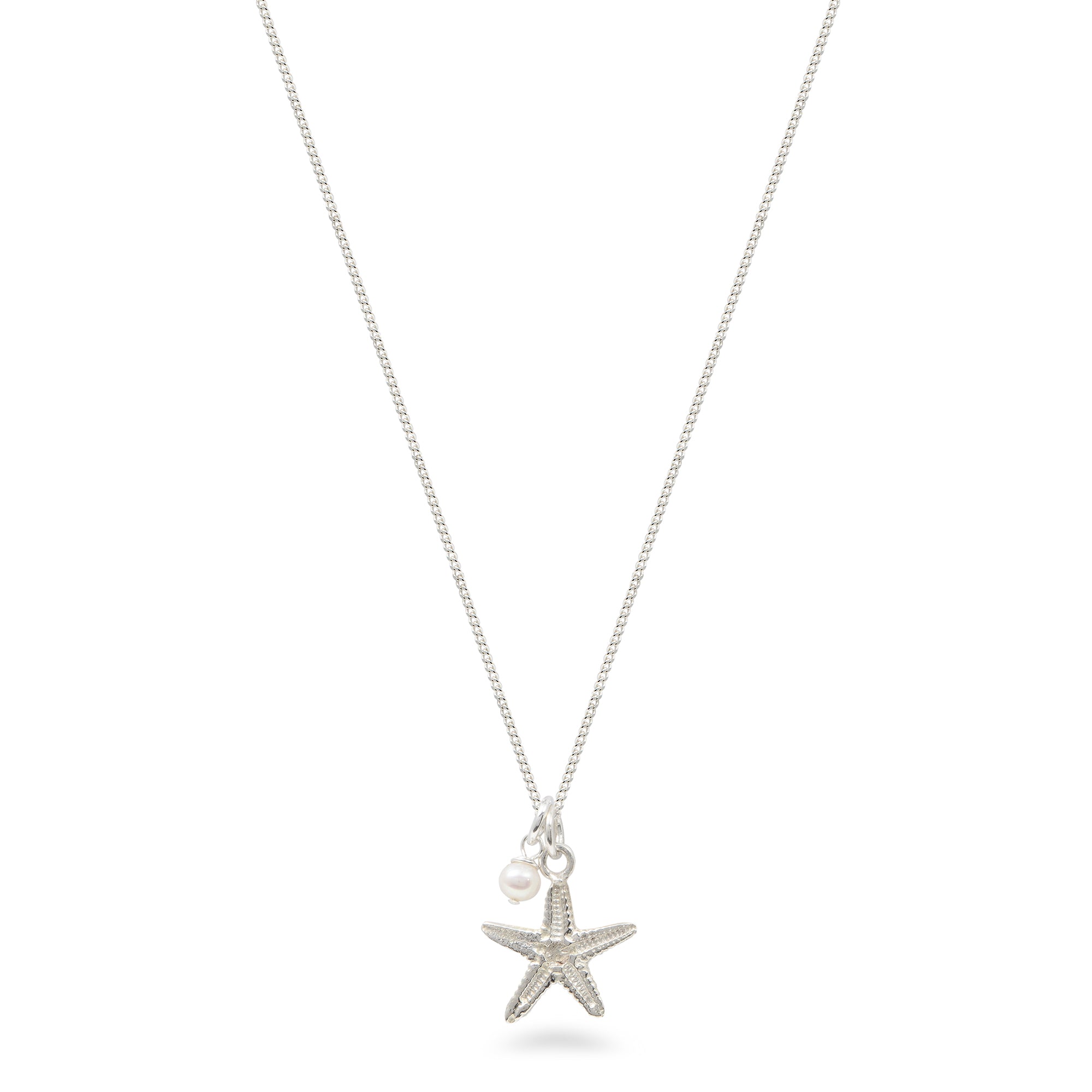 starfish and pearl necklace on white background