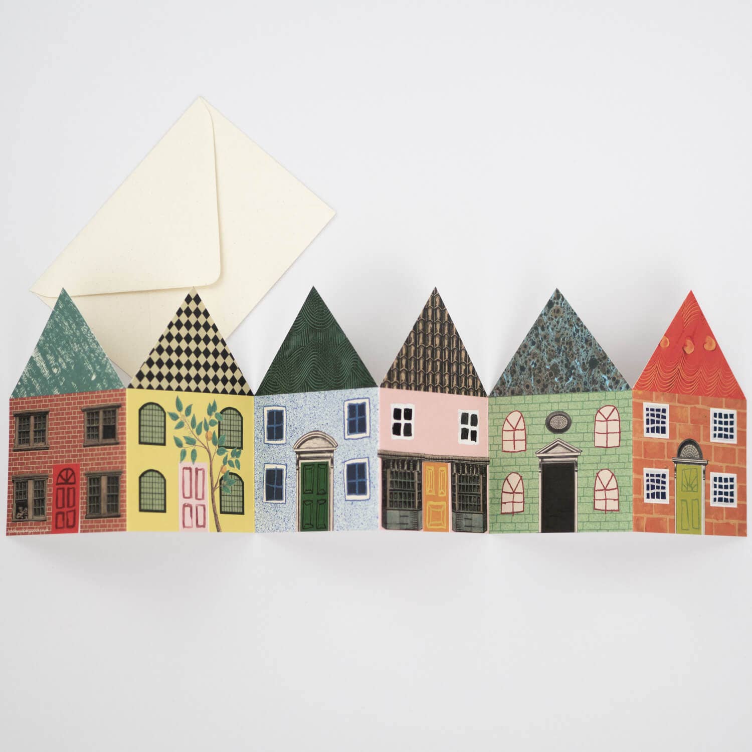 Card with colorful house designs on a white background