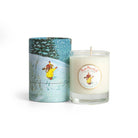 Candle with a decorative label and matching cylindrical container on a white background