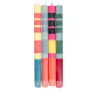 Set of four colourful striped candles on a white background