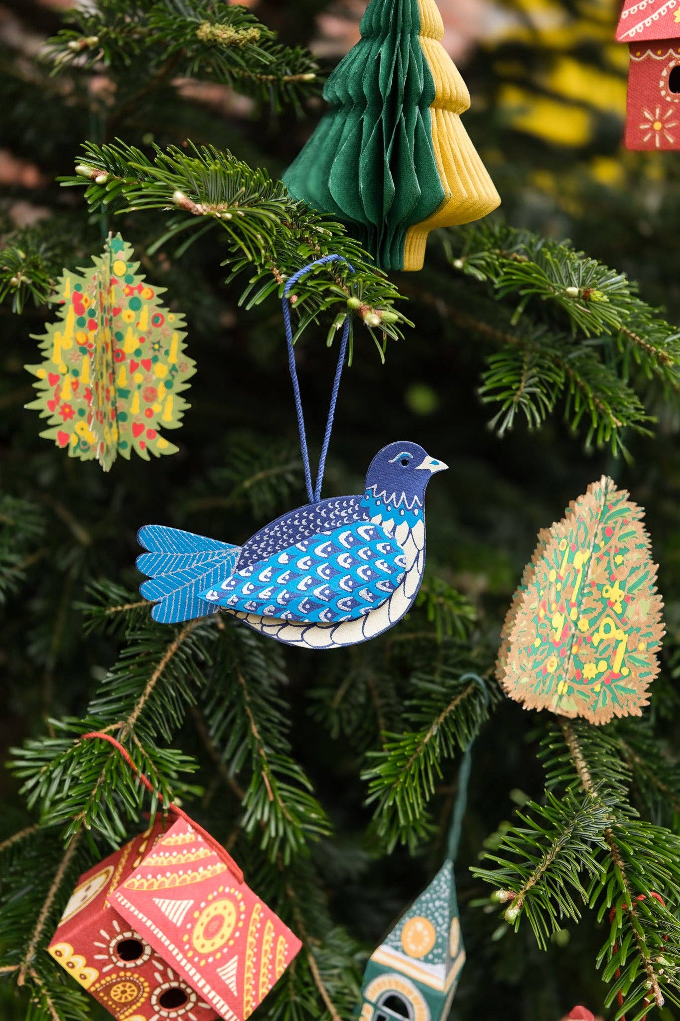 Colorful Christmas ornaments hanging on a tree