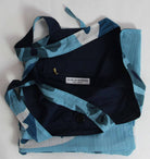 Blue and black patterned jacket with a visible brand label on a white background