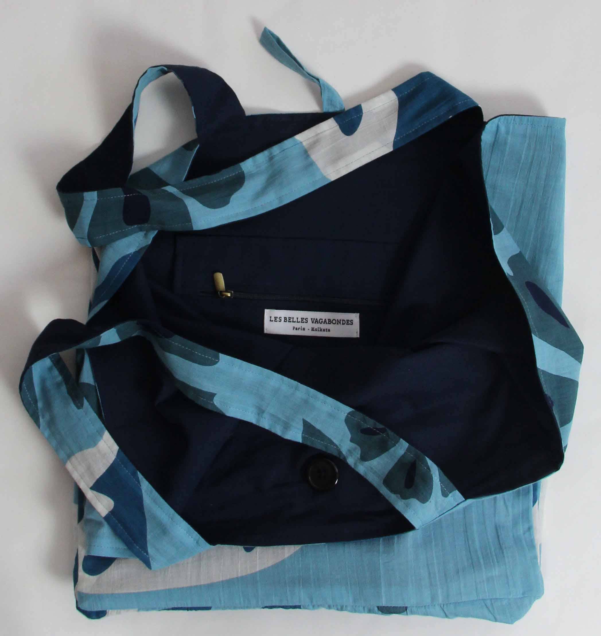 Blue and black patterned jacket with a visible brand label on a white background