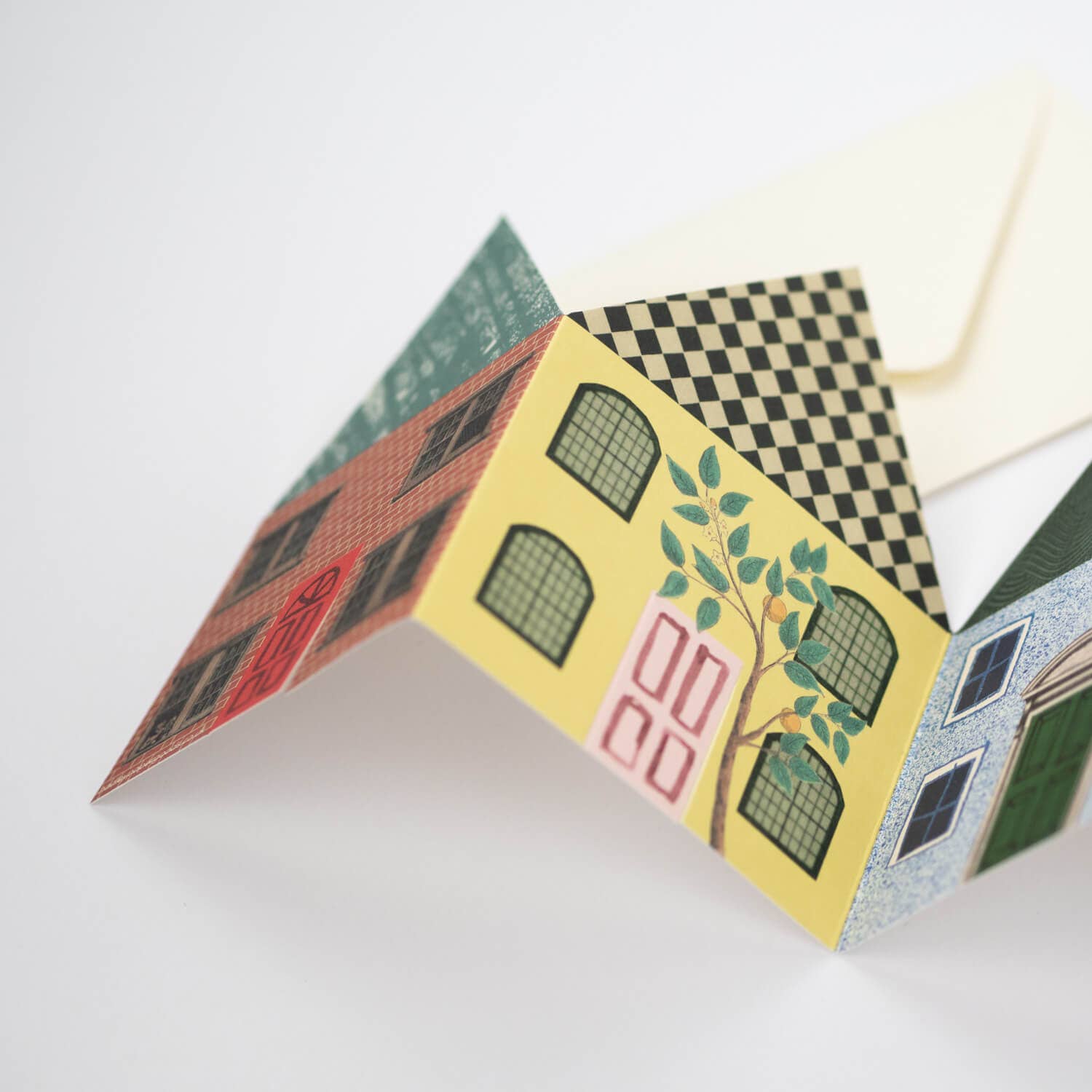 Colorful paper house model on a white background