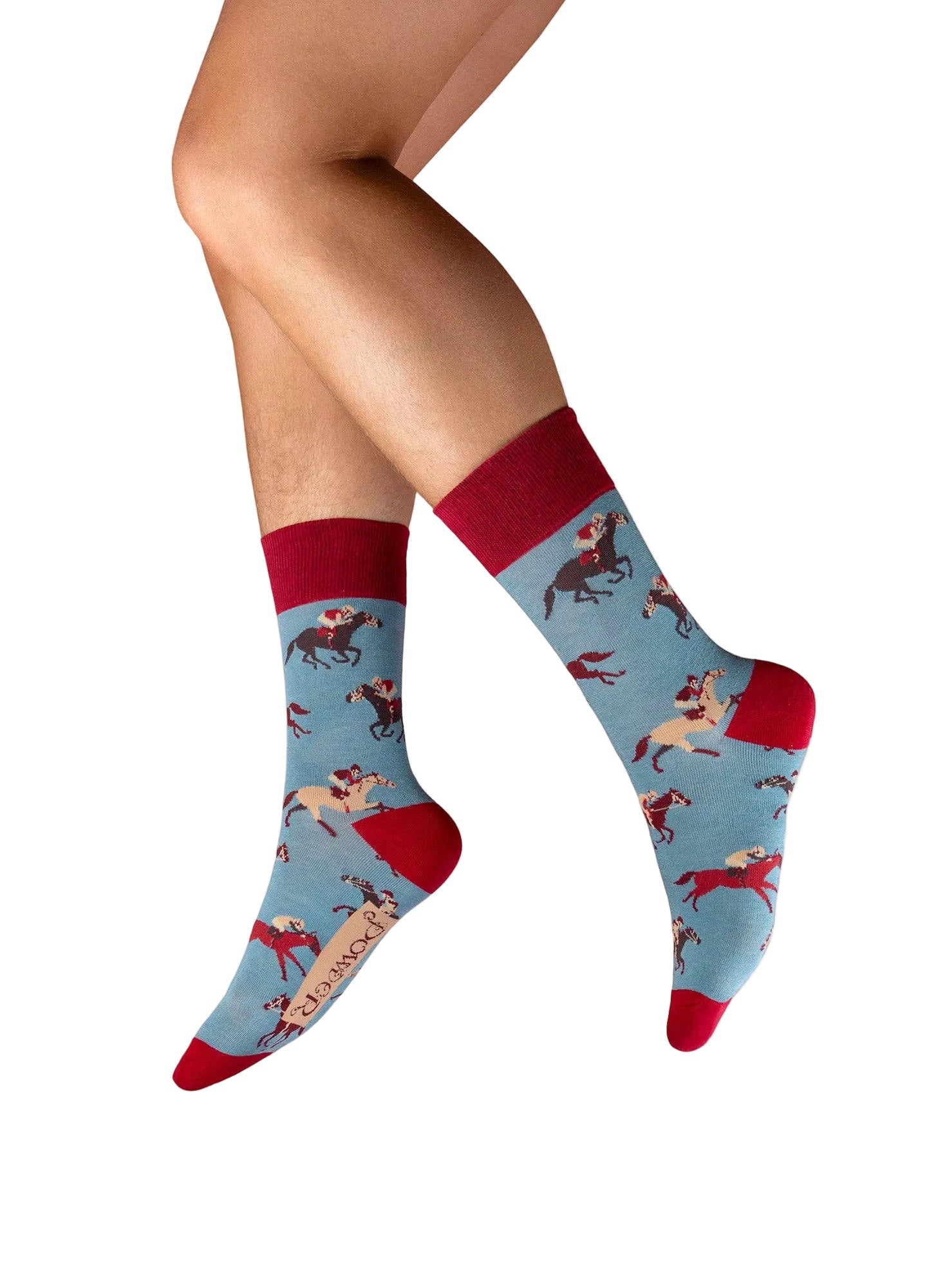 Blue socks with red accents and horse pattern worn by a person on a white background