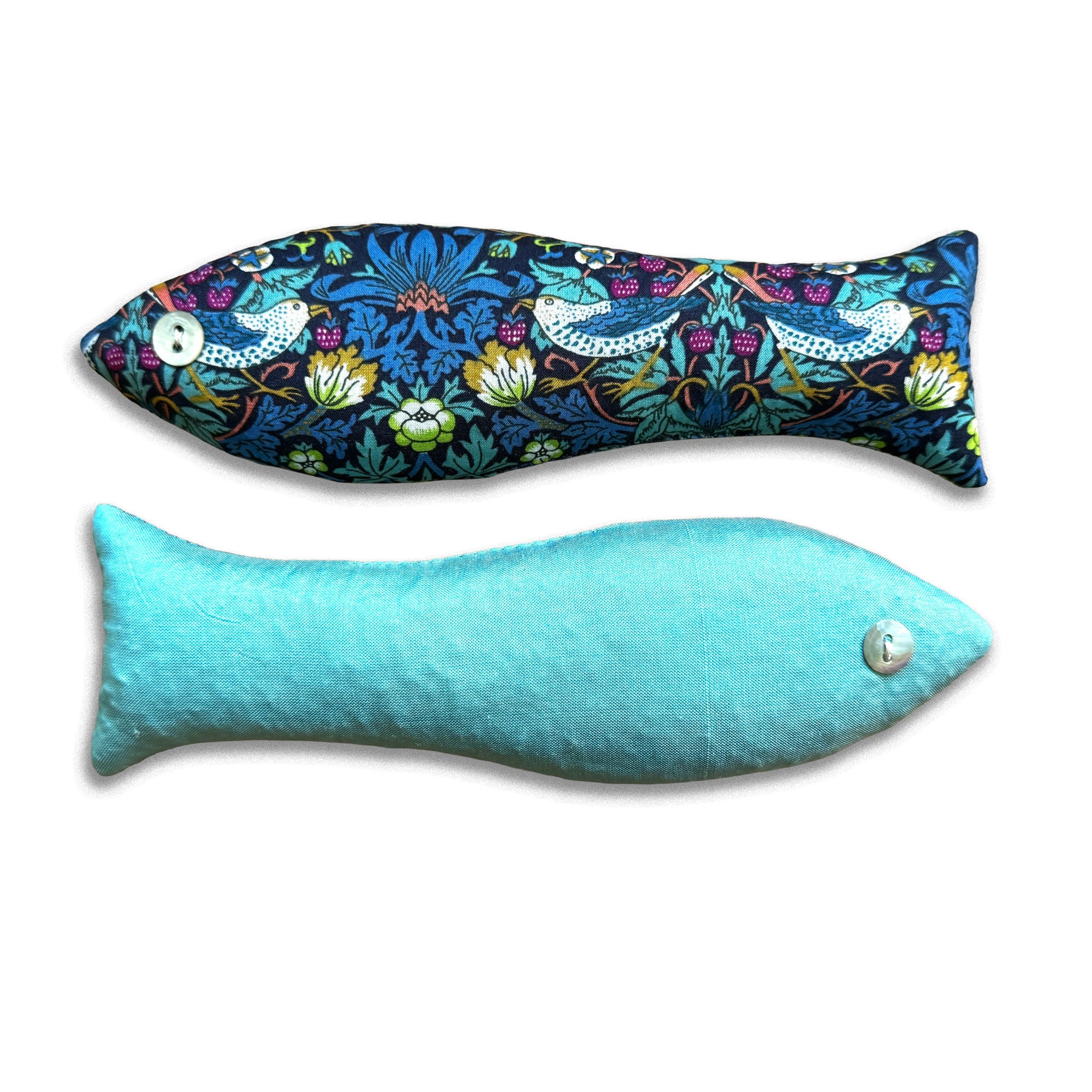 Two fish-shaped scented sachets, one with a colorful floral pattern and the other solid turquoise, on a white background.