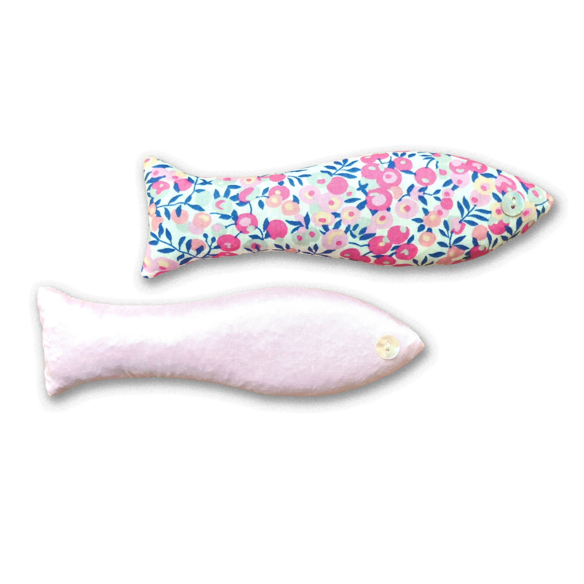 Two fish-shaped lavender sachets in pale pink silk and Liberty of London pink floral cotton, on a white background.