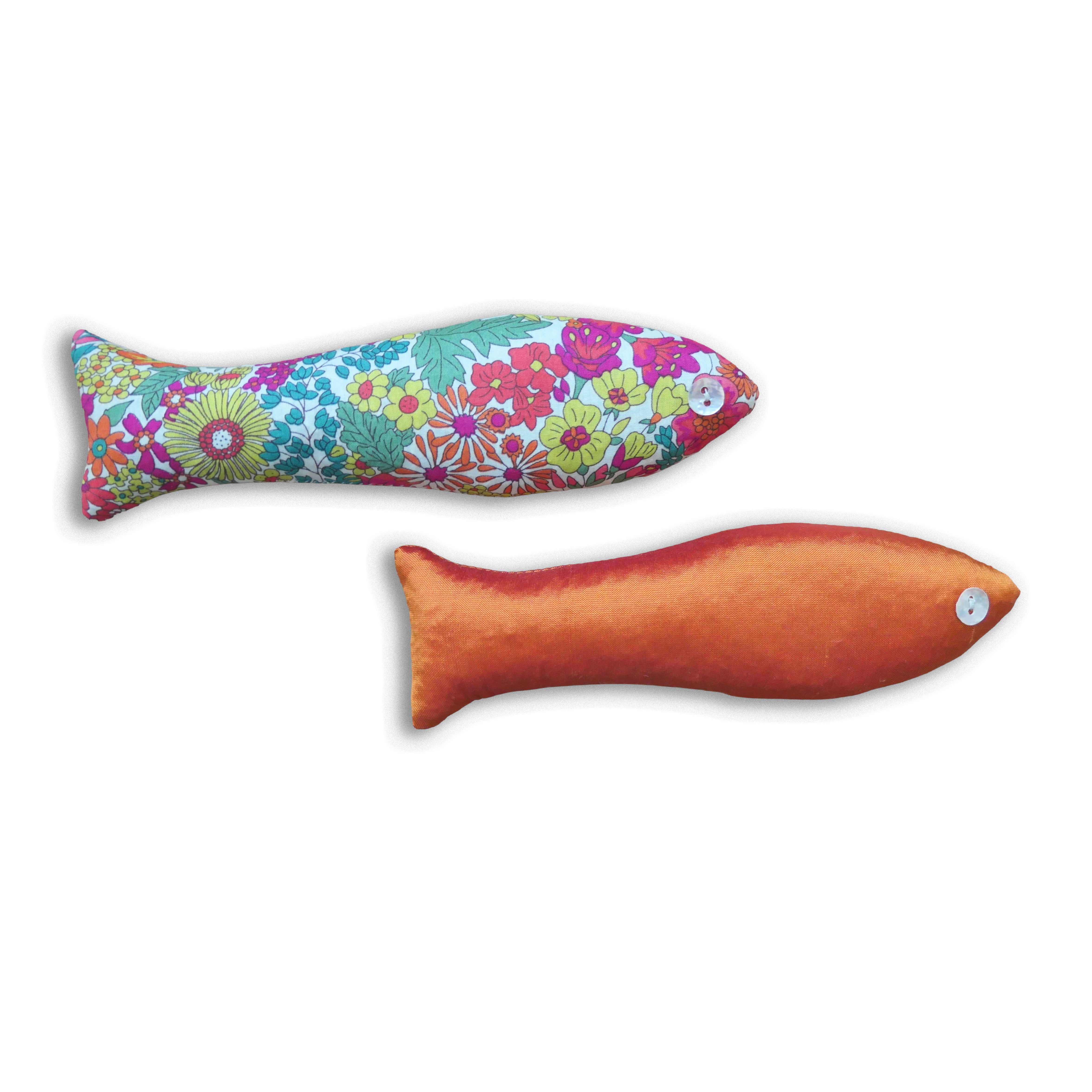 Two fish-shaped lavender bags, one floral and one orange, on a white background
