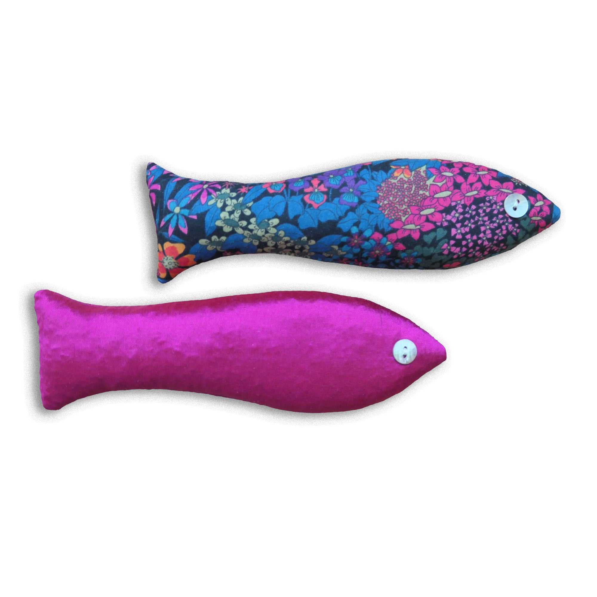 Bright pink and floral patterned cotton fish-shaped sachets on a white background.