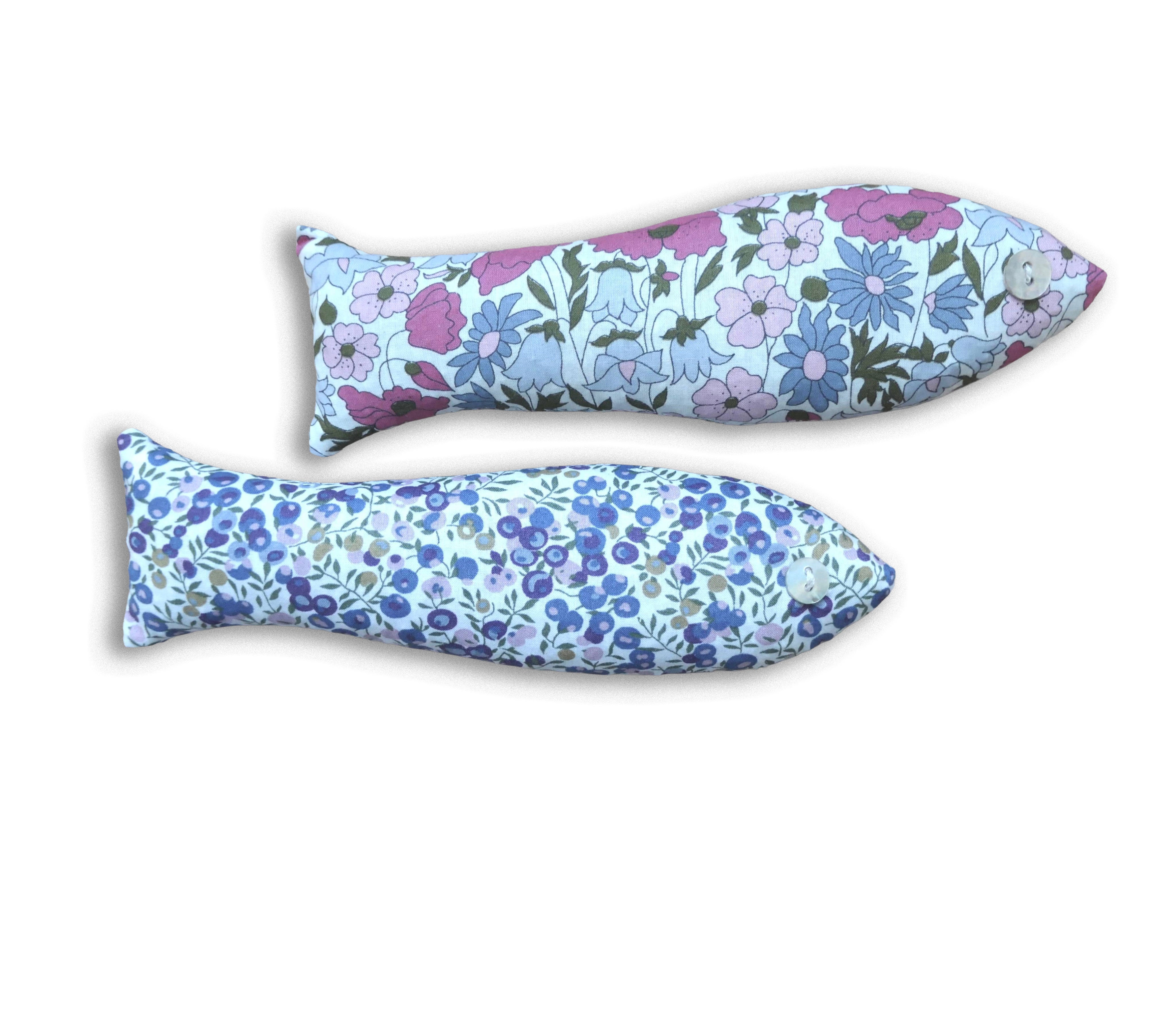 Two pink and pruplefish-shaped sachets on a white background