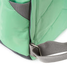 Close-up of a green bag with a grey strap on a white background