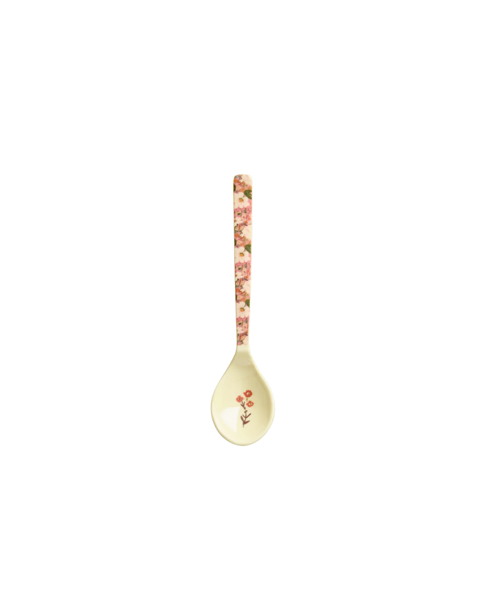 Decorative spoon with floral pattern on a white background