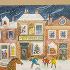 A whimsical winter village illustration with snow-covered buildings, a central sign reading '9 THE ANGELINN,' children playing in the snow, a horse, and festive storefront displays under a dark blue starry sky.
