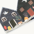 Concertina greetings card featuring houses and animals on a white background