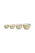 Set of four decorative jugs with striped patterns on a white background