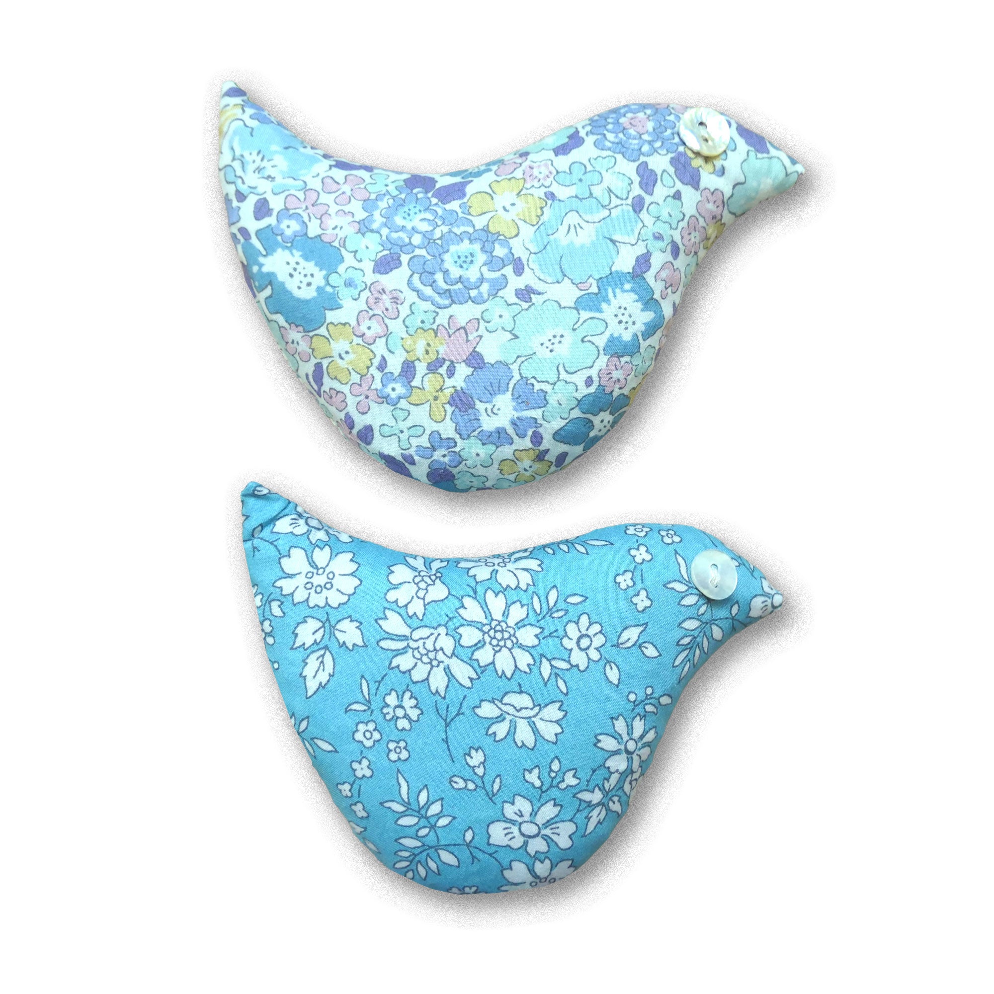 Two floral-patterned sachets in blues and lilacs on a white background