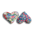 Two heart-shaped floral sachets in red and blue on a white background
