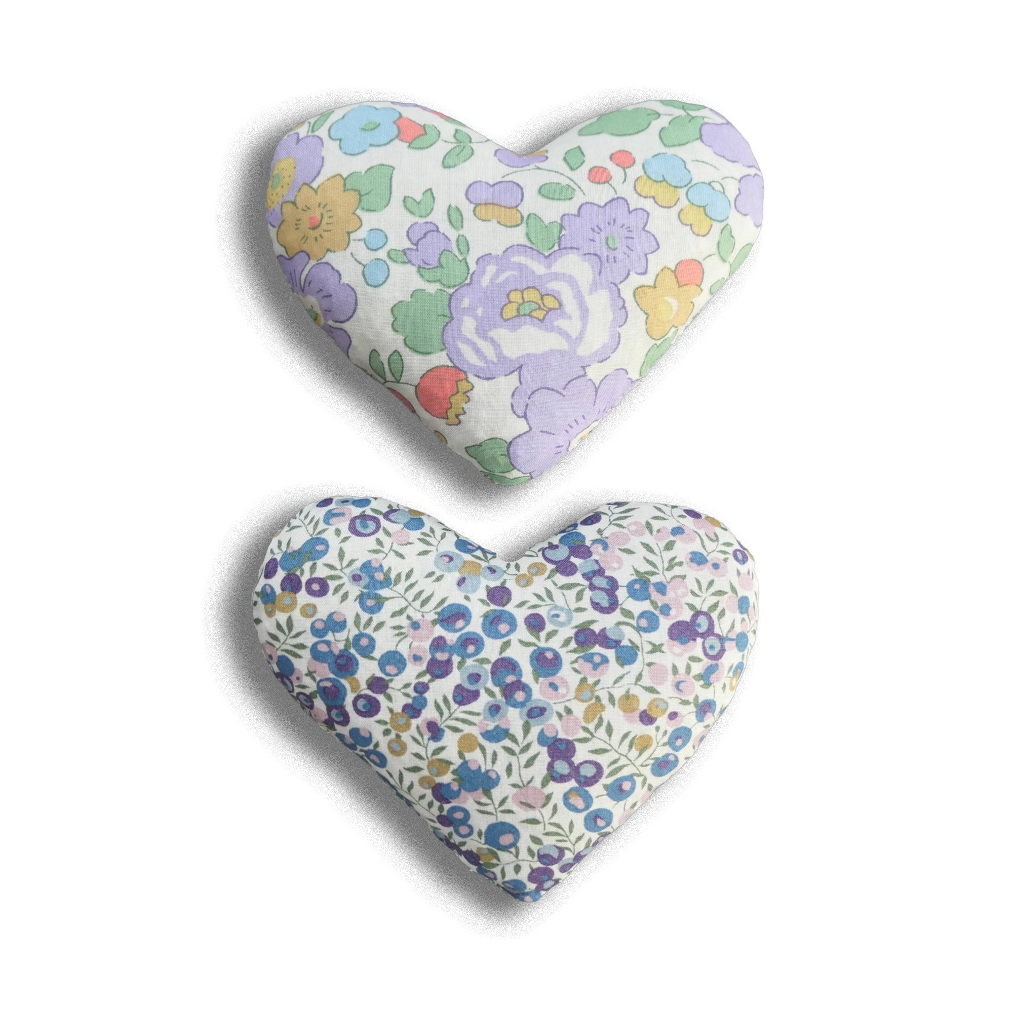 Two heart-shaped lavender bags with lilac floral patterns on a white background