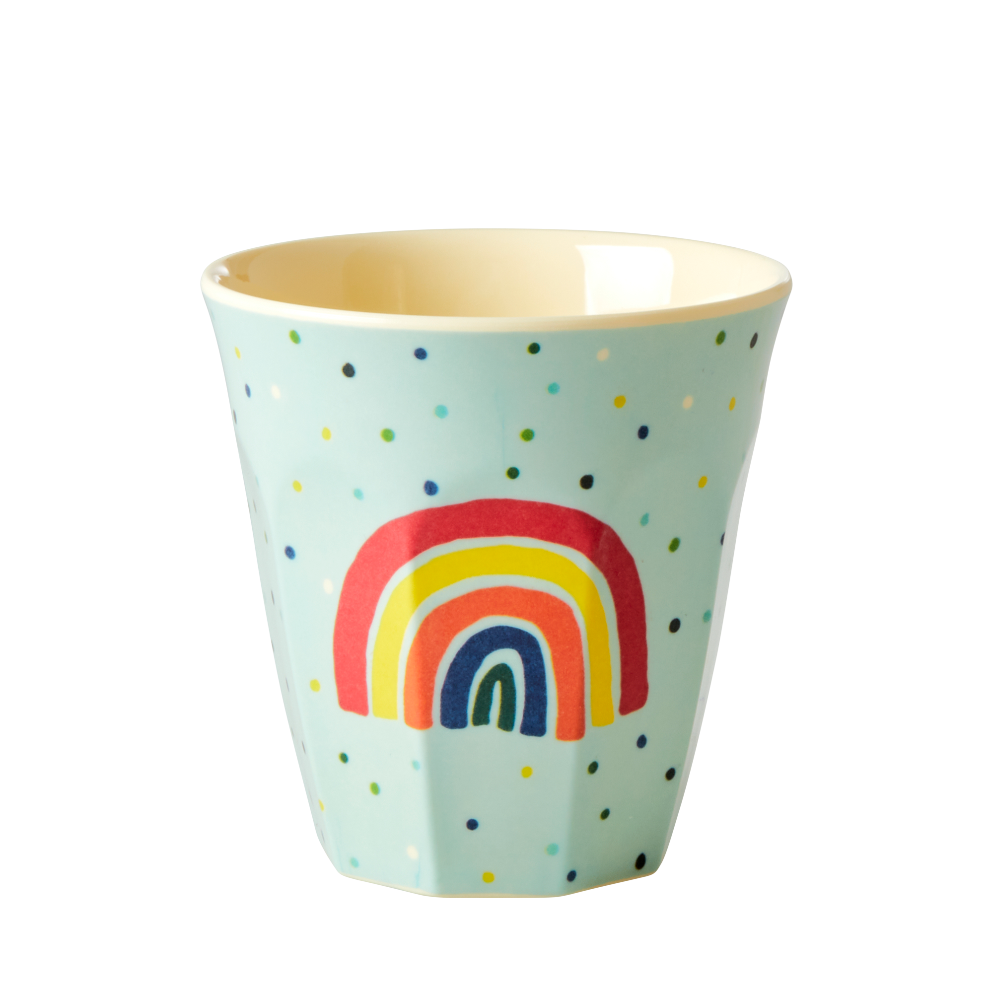 Light blue cup with rainbow design and polka dots on a white background
