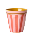 Pink and gold striped cup on a white background