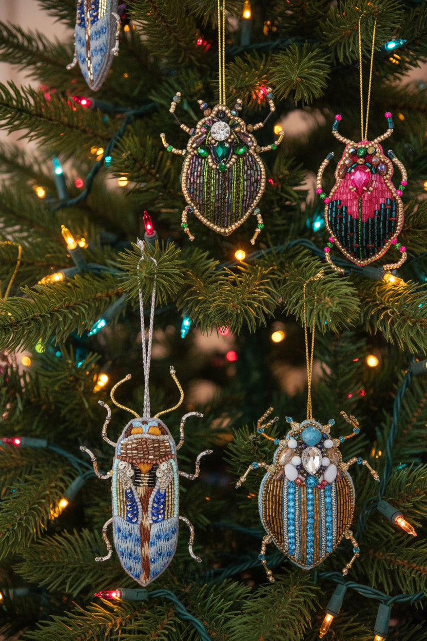 Decorative beetle ornaments with beadwork on a white background