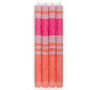 Set of four striped candles in pink and orange on a white background